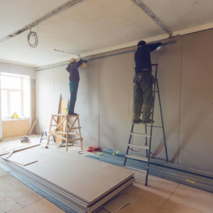 Commercial contractors working on a wall during a construction project in Colorado