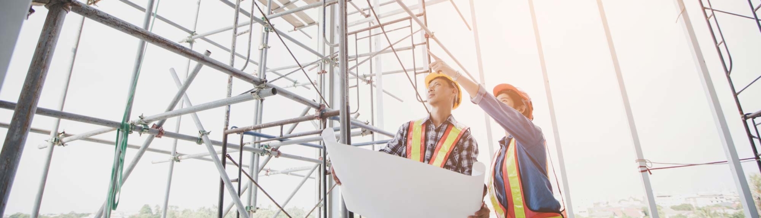 Construction Workers Pointing and Looking Upward