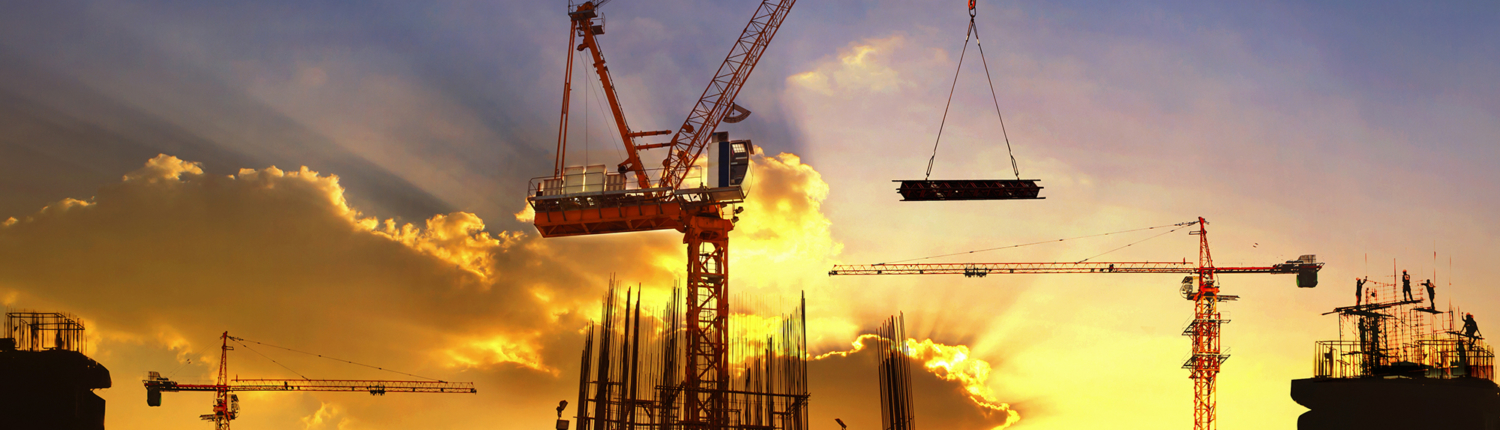 A crane moving metals while building a new facility