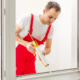 Construction worker applying caulk as part of a tenant finish project