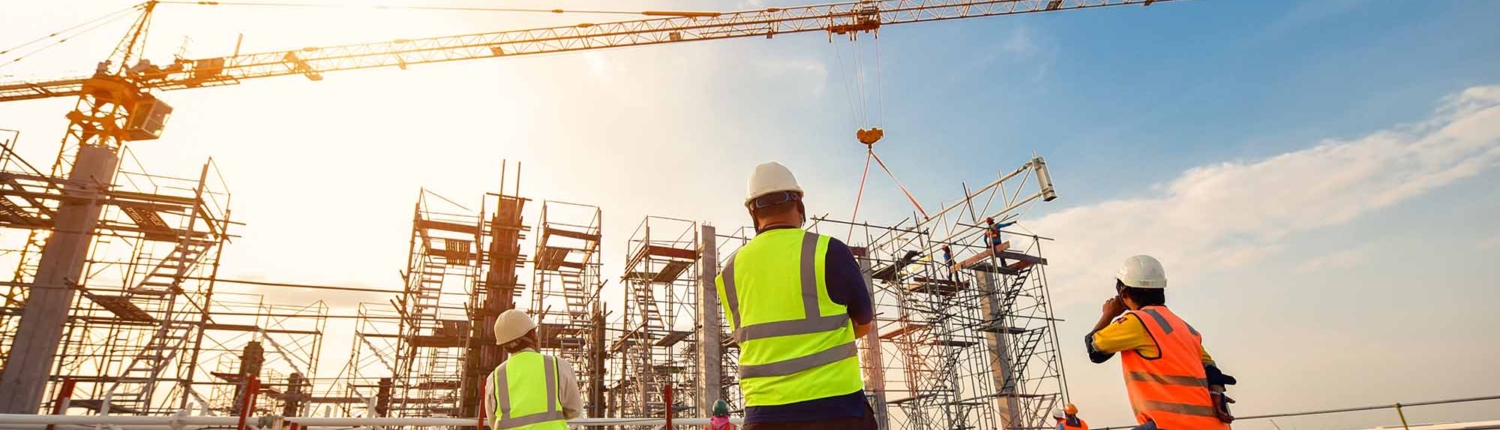 3 construction workers on a site