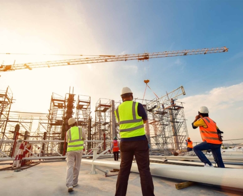 3 construction workers on a site