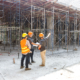 Construction concept of Engineer and Architect working at Construction Site with blue print