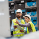 Industrial team evaluate the production process in high tech manufacturing plant