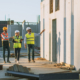 Diverse Team of Specialists Taking a Walk Through Construction Site
