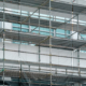 Metal scaffolding pipe framework construction was installed on the commercial high-rise building